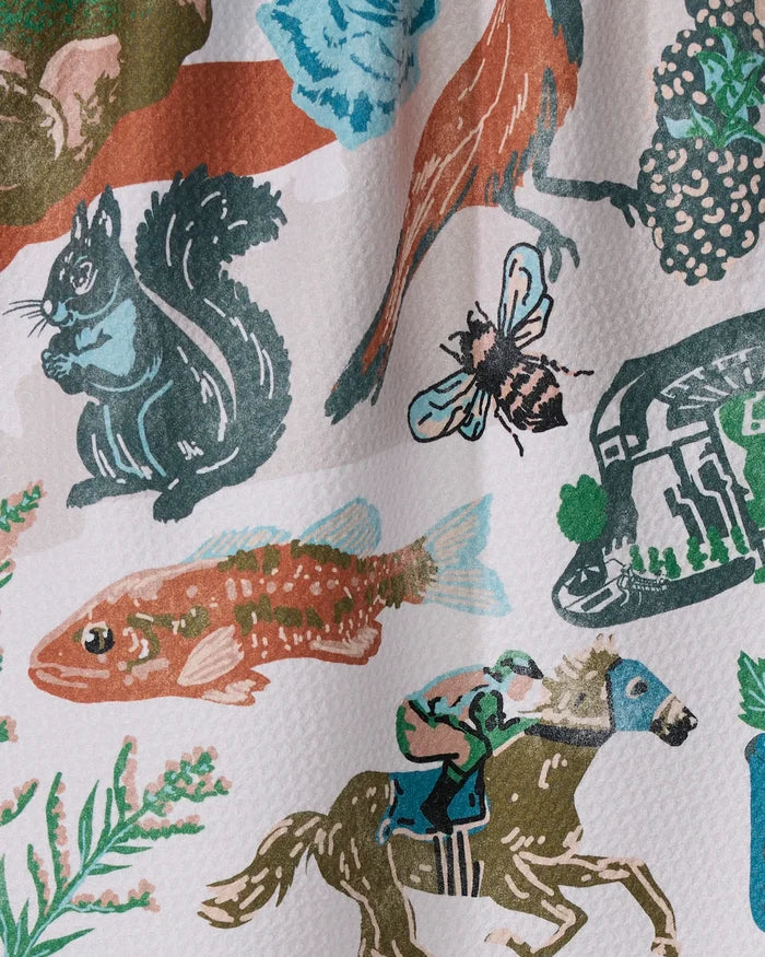 Greetings From Kentucky by Geometry: This quick-dry kitchen dish towel features a textured white background with colorful illustrations of a squirrel, bird, bee, fish, horseback rider, greenery, and rocks—both stylish and functional.