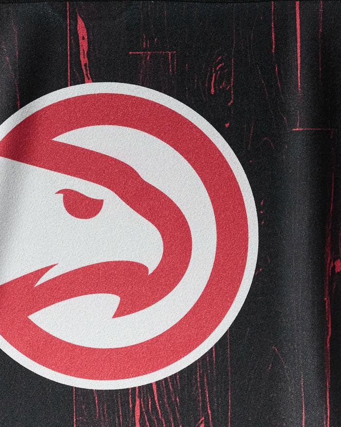 A close-up of the Atlanta Hawks logo from the "Hawks Zone" NBALAB x Geometry towel—a stylish, sustainable workout must-have for NBA fans.