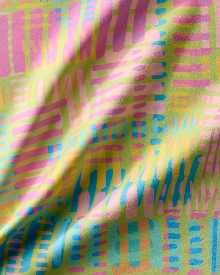 The "Positive Vibes" Geosuede fabric by Sareka Unique features abstract pastel patterns in pink, blue, yellow, and green with a wavy texture—ideal for making recycled dinner napkins or a unique Dinner Napkin Set.