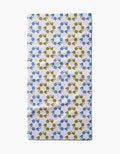 The Kayla Ann Recycled Floral Bar Towel is rectangular and ultra-absorbent, featuring a repeating pattern of blue and green frogs in alternating rows. Made from post-consumer recycled materials, it’s displayed flat on a plain white background.