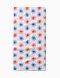 The Kayla Ann Sparkler Splash Bar Towel features a rectangular white Geoweave fabric with rows of evenly spaced red and blue starbursts for stylish, durable flair.