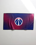 The Wizards Fade by NBALAB x Geometry is a rectangular quick-drying gym towel with a red-to-blue gradient and Washington Wizards logo centered, shown laid flat on a light surface.