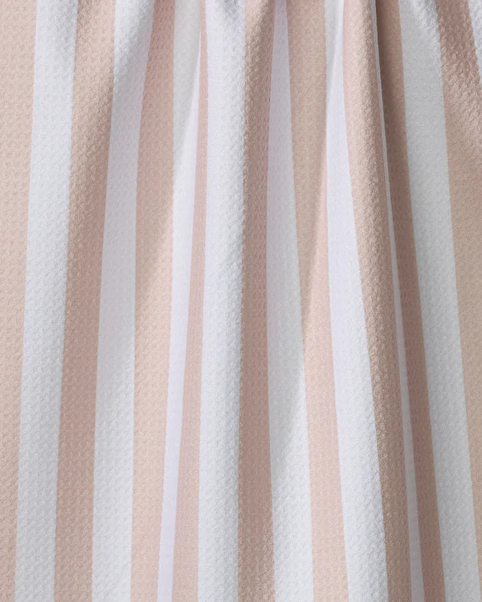 Close-up of the Kailee Wright Yvonne Stripe kitchen towel, featuring vertical beige and white stripes, a slightly textured surface, gentle folds, and crafted from recycled materials.